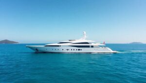 Megayacht cruising turquoise waters.