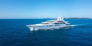 Luxury yacht with sleek design on blue water.