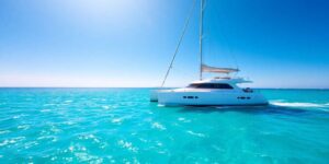 Luxurious 4 bedroom catamaran sailing turquoise waters.