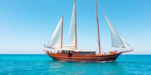Luxury gulet sailing on turquoise Mediterranean waters.