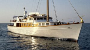 Elegant 1920s yacht on the water.