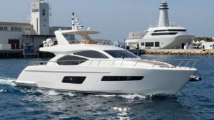 Yacht on water near a science lab.