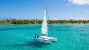 Sailboat on clear turquoise water in Florida Keys.