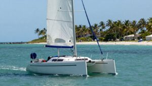 Sailboat on Florida waters with palm trees