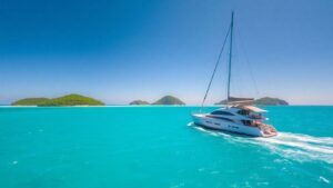 Sailboat on turquoise water in the British Virgin Islands.