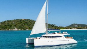 Luxury yacht sailing in clear turquoise waters of BVI.