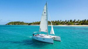 Sailboat on clear turquoise water in Florida Keys.