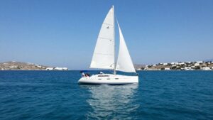 Sailboat on Aegean Sea near Greek islands.