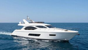Luxury 40-foot yacht sailing on a clear blue ocean.