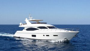 Luxurious yacht sailing on a calm blue ocean.