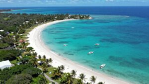 Aerial view of Grand Bahama Island coastline and turquoise waters.