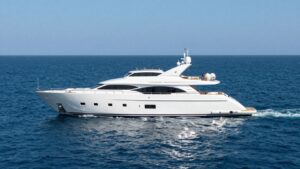 Luxurious yacht sailing on a calm blue ocean.