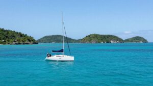 Sailboat on turquoise water near Belize islands