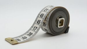 Measuring tape showing meters and feet conversion.