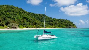 Sailboat on turquoise water near Tortola, BVI.