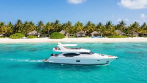 Luxury yacht sailing in the Bahamas turquoise waters.