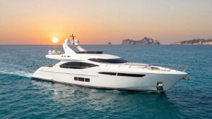 Luxury yacht sailing in Ibiza at sunset.