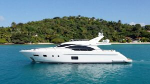 Luxury motor yacht Sirocco sailing on calm turquoise waters.