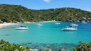 Sailboats anchored in Tortola's clear turquoise waters.
