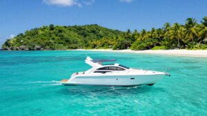 Luxury yacht sailing in clear turquoise waters near St. Thomas.