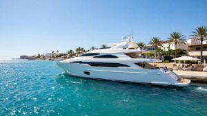 Luxurious yacht sailing on turquoise Ibiza waters.