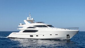 Luxury 40m yacht sailing on a clear blue ocean.