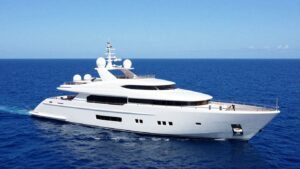 Luxurious superyacht on a clear blue ocean.