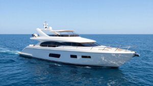 Luxurious Below Deck yacht sailing on a clear blue ocean.