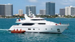 Luxury yacht sinking in Miami waters with rescue boats.