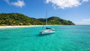 Sailboat on turquoise water near Abacos islands.