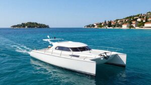 Catamaran sailing on clear blue Adriatic Sea near Croatia