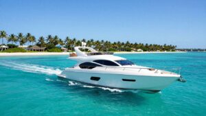 Luxury yacht sailing in clear turquoise Bahamian waters.