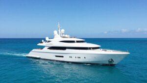 Luxurious superyacht on a calm, blue ocean.