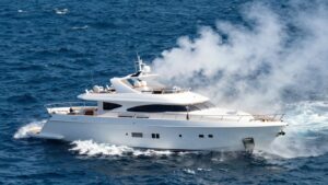 Luxury yacht sinking into the ocean waves.