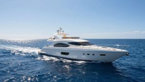 Luxurious yacht sailing on a clear blue sea.