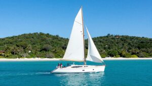 Sailing yacht on turquoise water near Antigua islands.